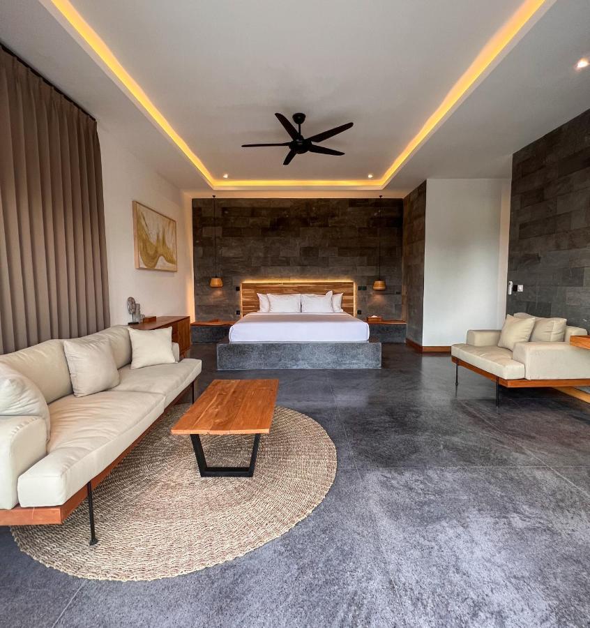 Neano Escape Hotel Manggis Exterior foto A bedroom at the resort