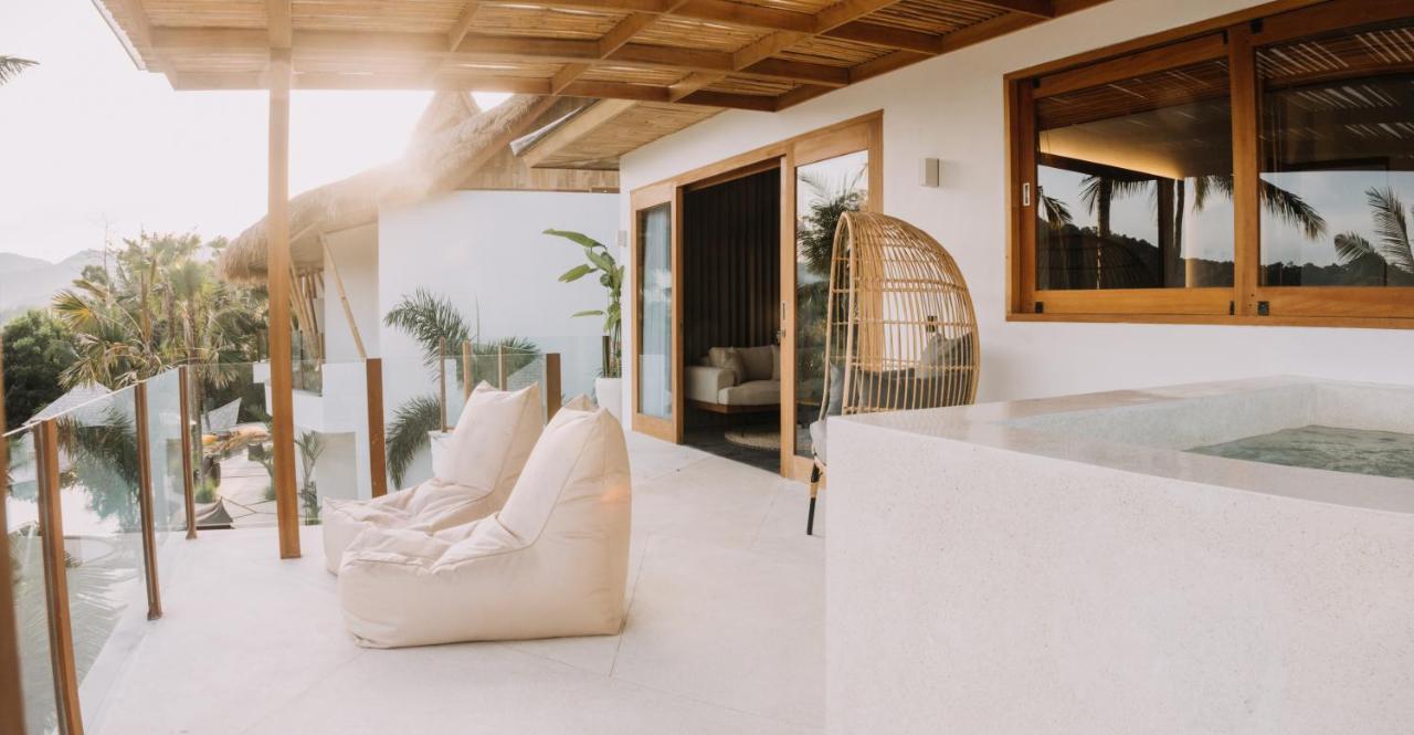 Neano Escape Hotel Manggis Exterior foto The interior of a villa at the resort