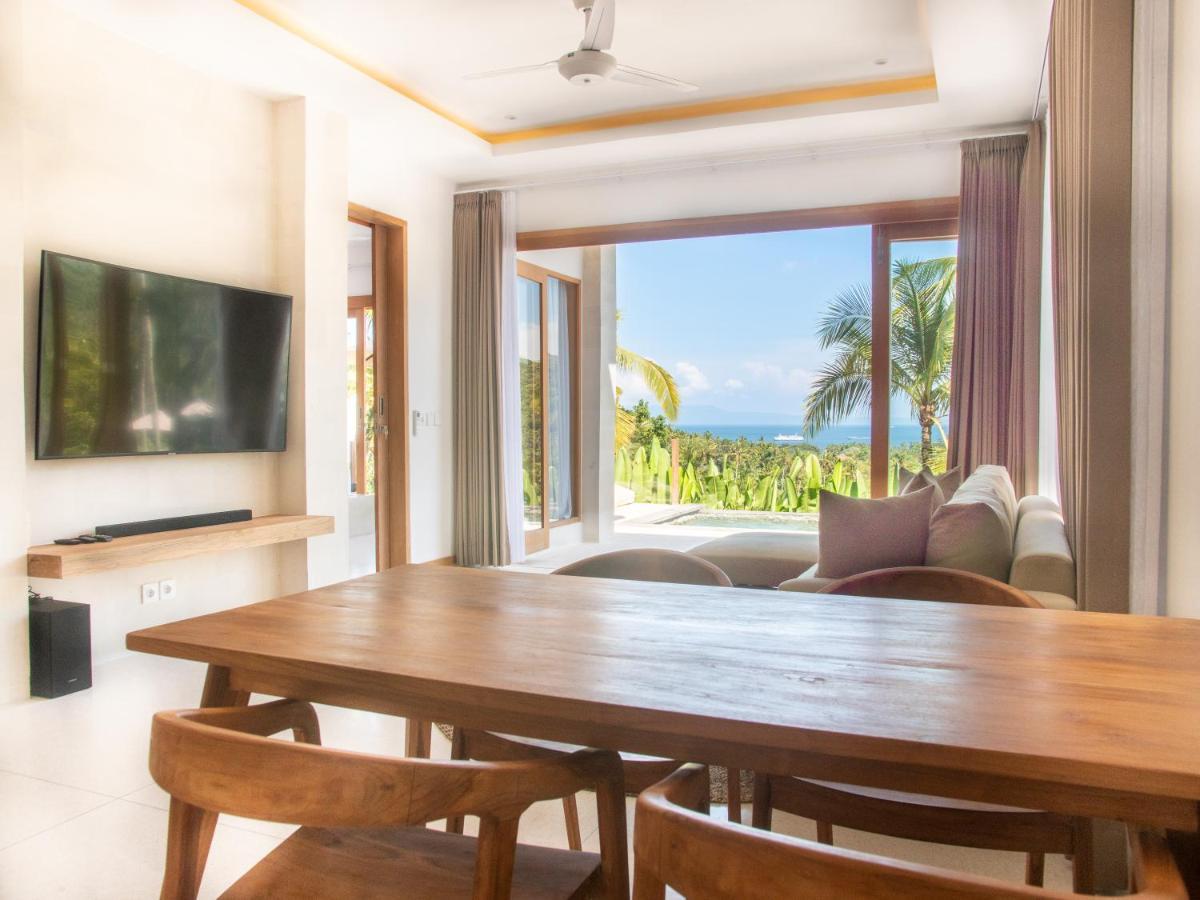 Neano Escape Hotel Manggis Exterior foto Living room at the Beachfront Pool Villa